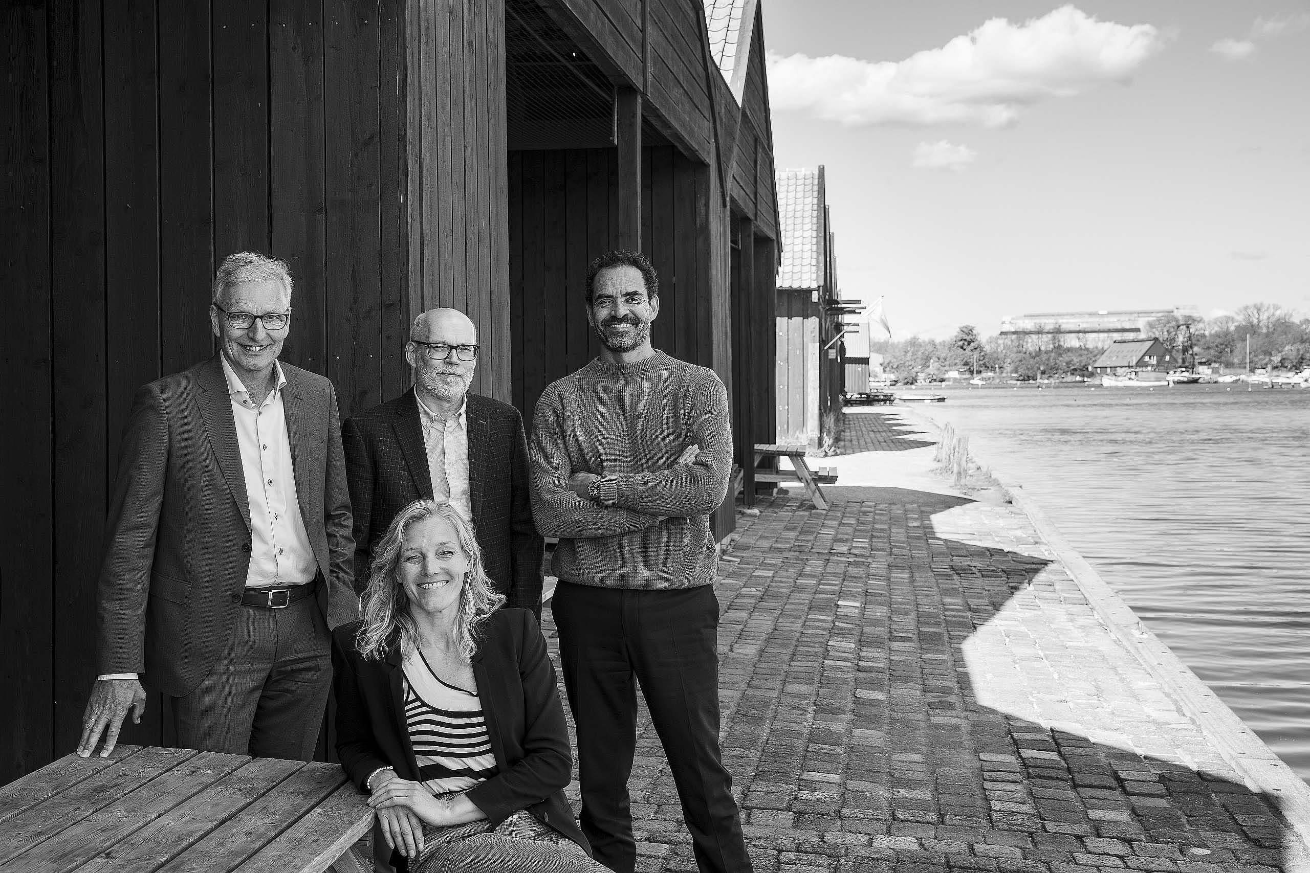 KHR Architecture's partners in front of the cannon boathouses on Holmen where the firm has had offices for the last 15 years